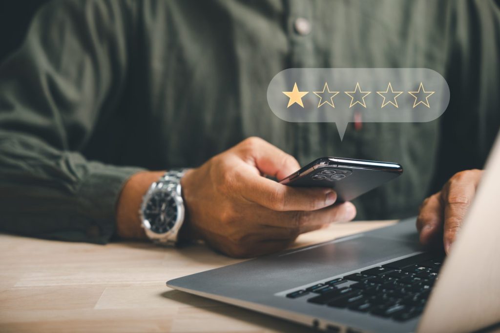 Negative feedback concept. Dissatisfied customer experience. 1-star rating review in survey. Unhappy client expressing sadness emotion face. Bad user experience on smartphone. Business dissatisfaction